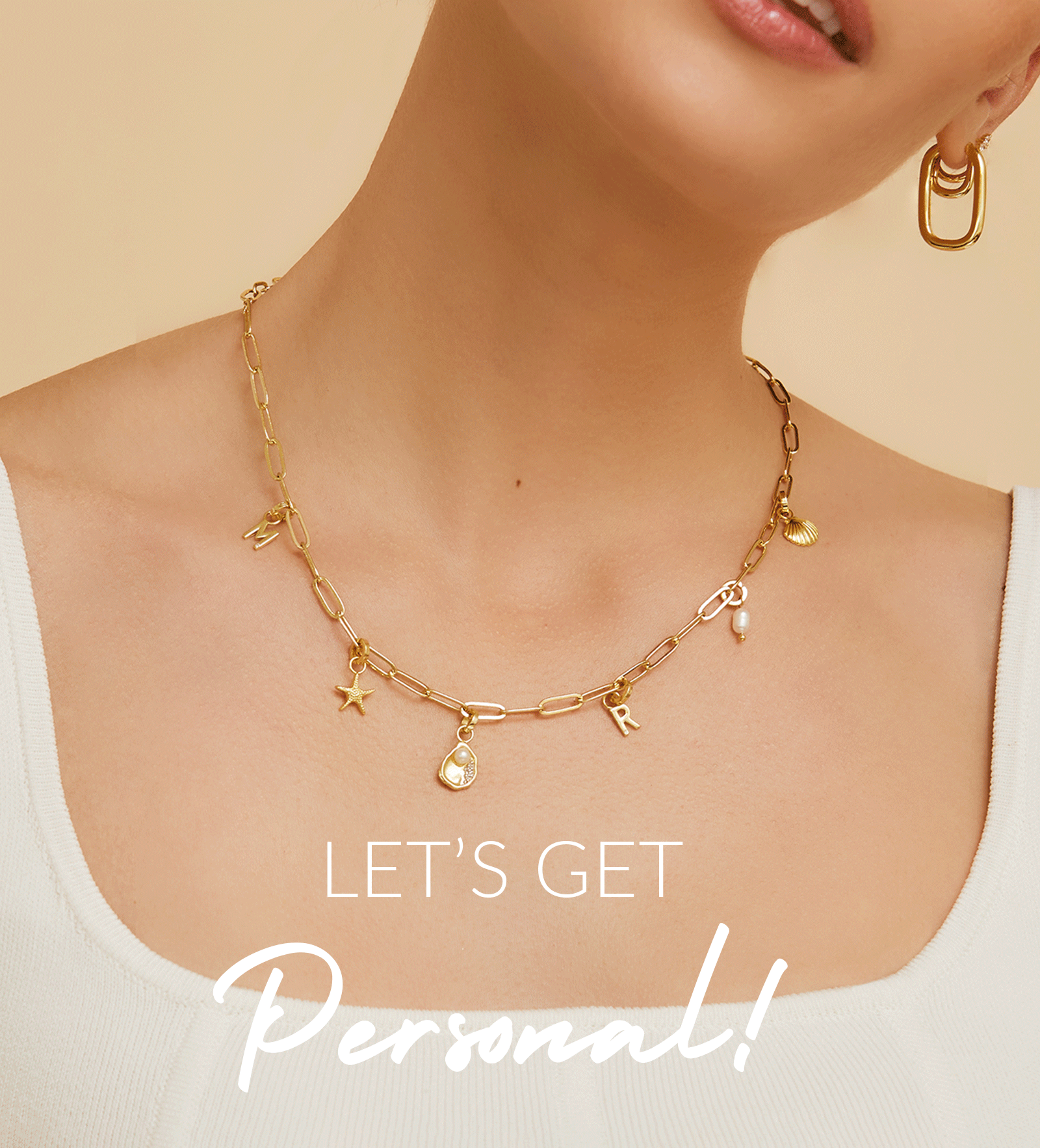 Stylish woman wearing a personalized necklace that says 'Let's get personal' from Arms Of Eve