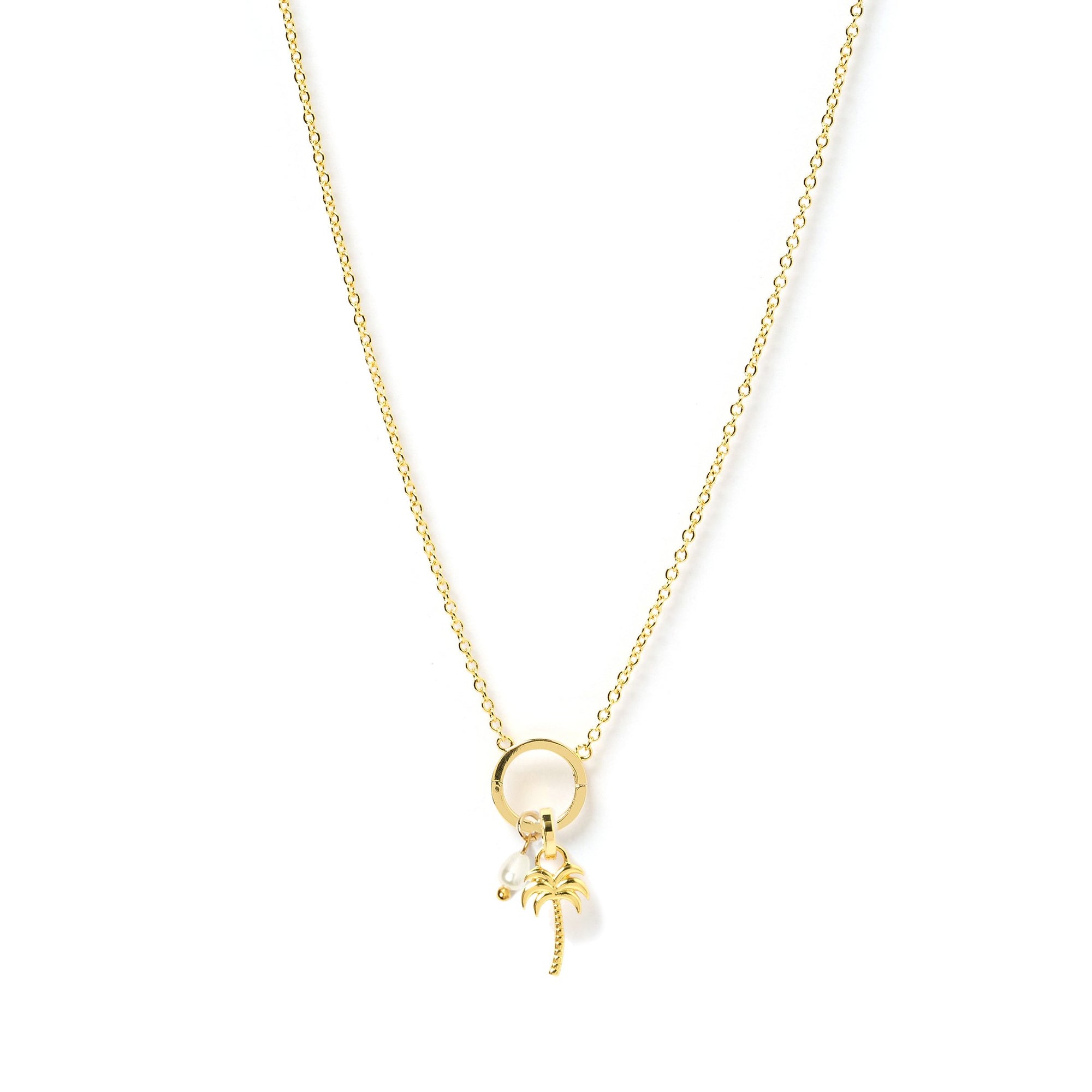 Arms Of Eve Palm Springs 'O' charm gold necklace featuring palm tree pendant, adding touch of tropical charm to any outfit